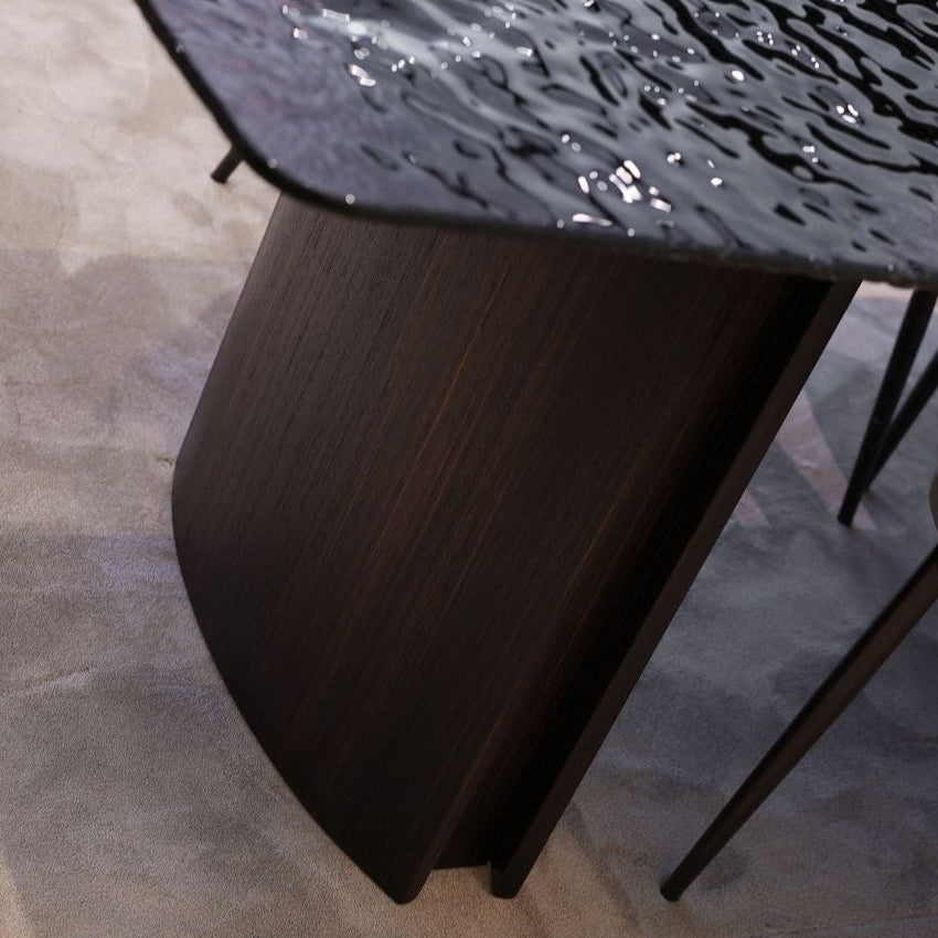 Side angle of the Flow Dining Table, highlighting its sleek edges and modern craftsmanship.
