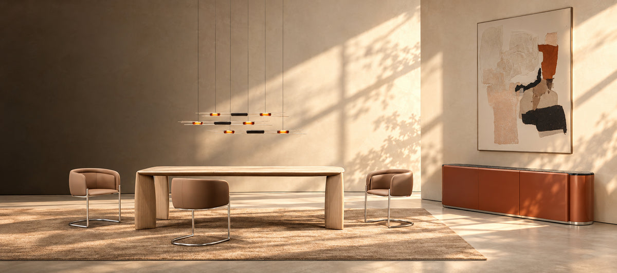 Canapy Furniture Fall Design Edit sunlit modern dining interior with oak table, tan upholstered chairs, warm window shadows and rust sideboard