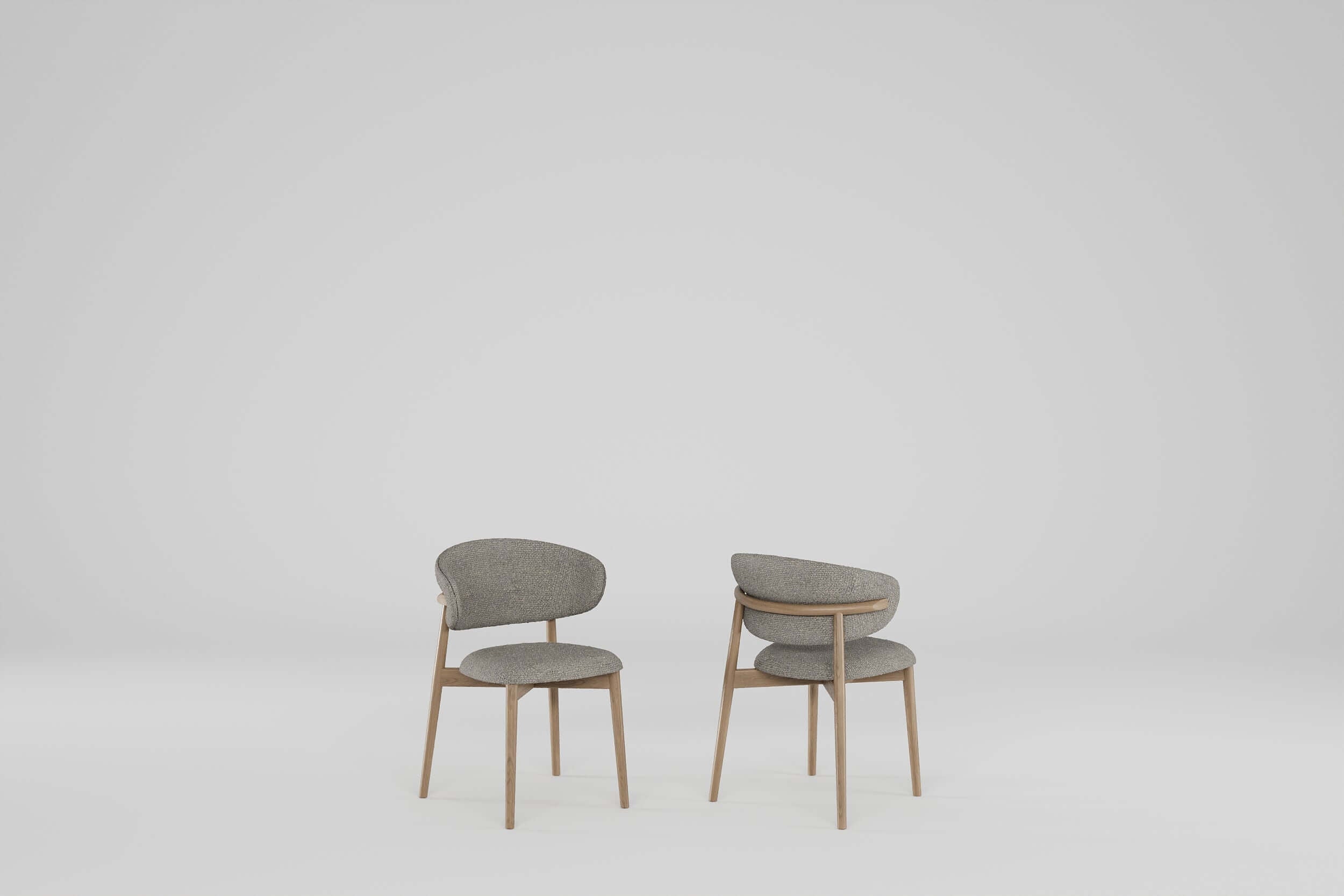 Tierra Oak Dining Chair with curved backrest, smooth oak frame, and textured fabric upholstery in natural tones. Elegant and comfortable Nordic-inspired design.