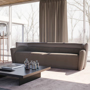 Wave Sofa featuring a curved design, upholstered in premium fabric for modern comfort and elegance.