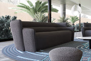 Wave Sofa featuring a curved design, upholstered in premium fabric for modern comfort and elegance.