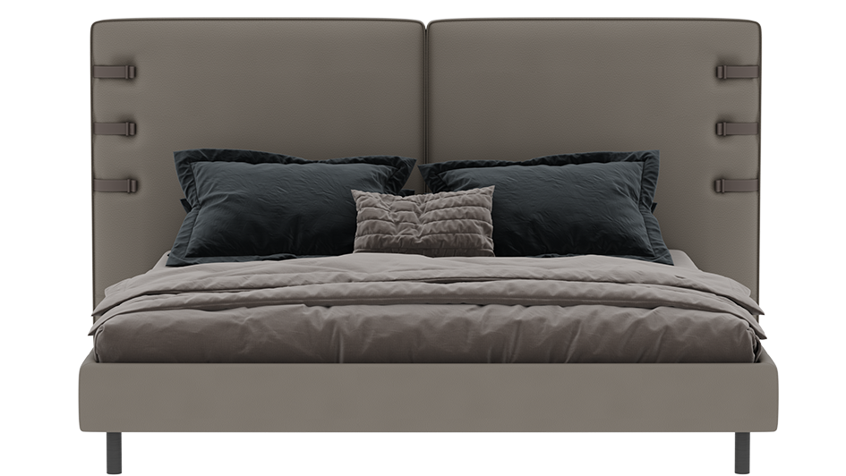 Gray upholstered bed with dark pillows on a white background