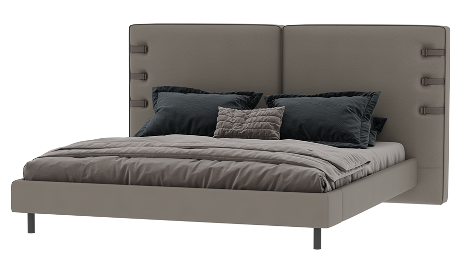 Gray upholstered bed with dark gray bedding on a white background
