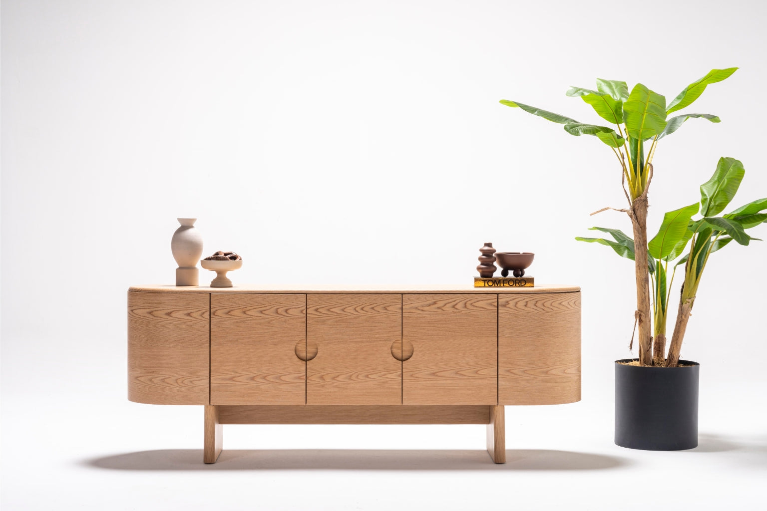 Front view of the Alva Console showcasing a sleek minimalist design and spacious storage options.