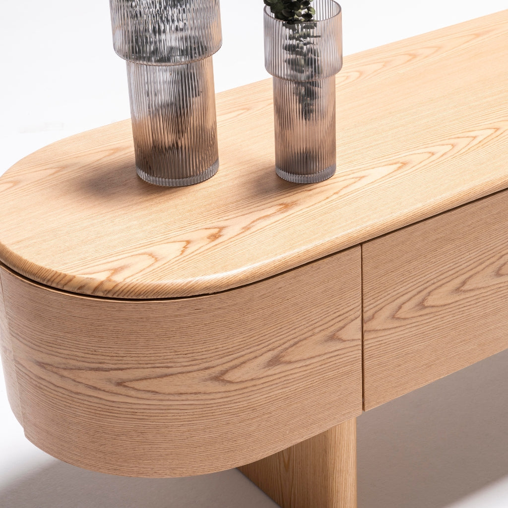 Alva Console styled with vases, books, and a table lamp for a chic and functional look.