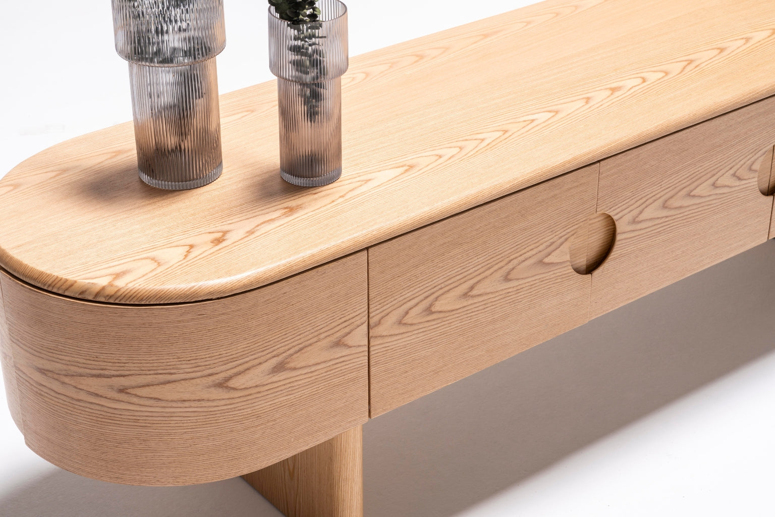 Alva Console styled with vases, books, and a table lamp for a chic and functional look.