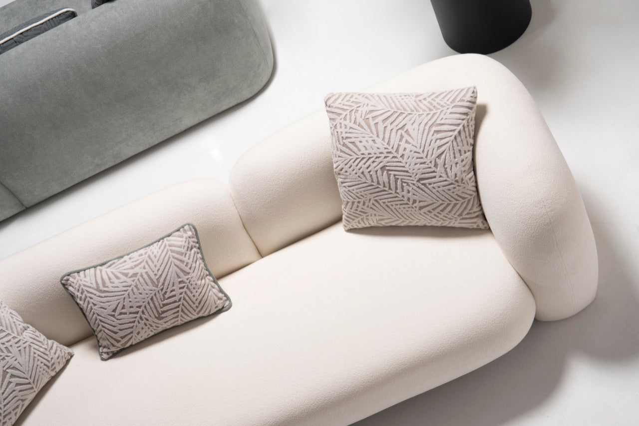 Side profile of the Alva Sofa, emphasizing its elegant lines and premium materials.
