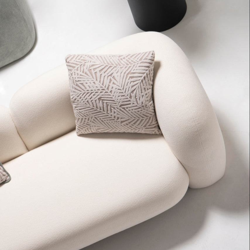 Side profile of the Alva Sofa, emphasizing its elegant lines and premium materials.