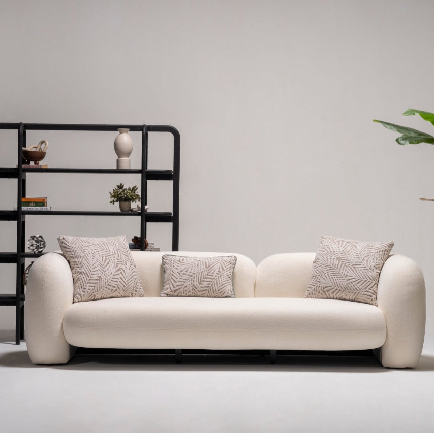 Side angle of the Alva Sofa, highlighting its sleek design and plush seating.