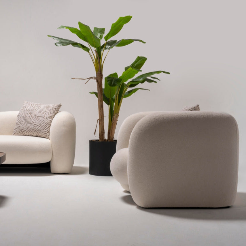 Alva Sofa styled with decorative pillows, adding warmth and charm to any space.