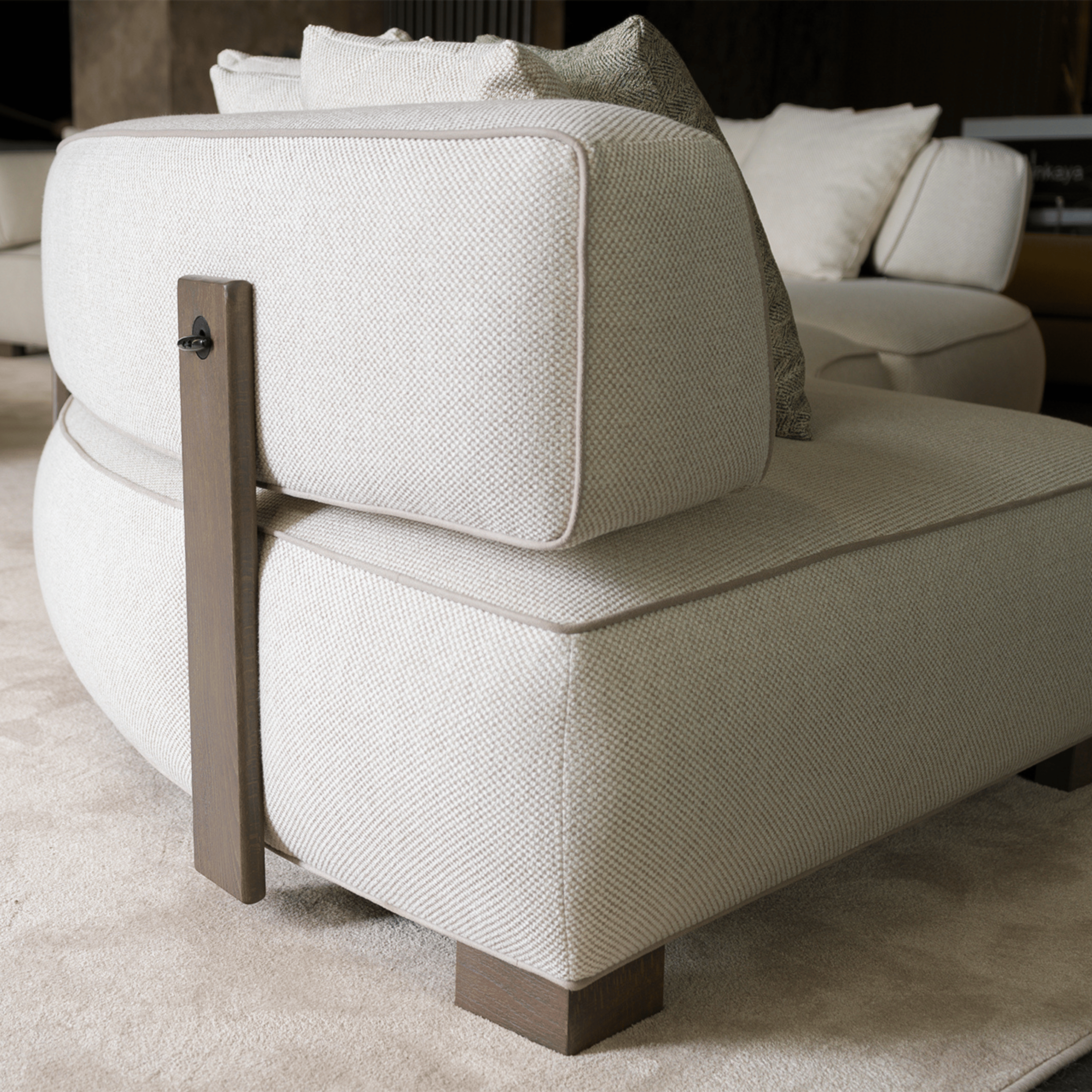 Side angle of the Curved Modular Sofa showcasing its sleek curves and customizable layout.