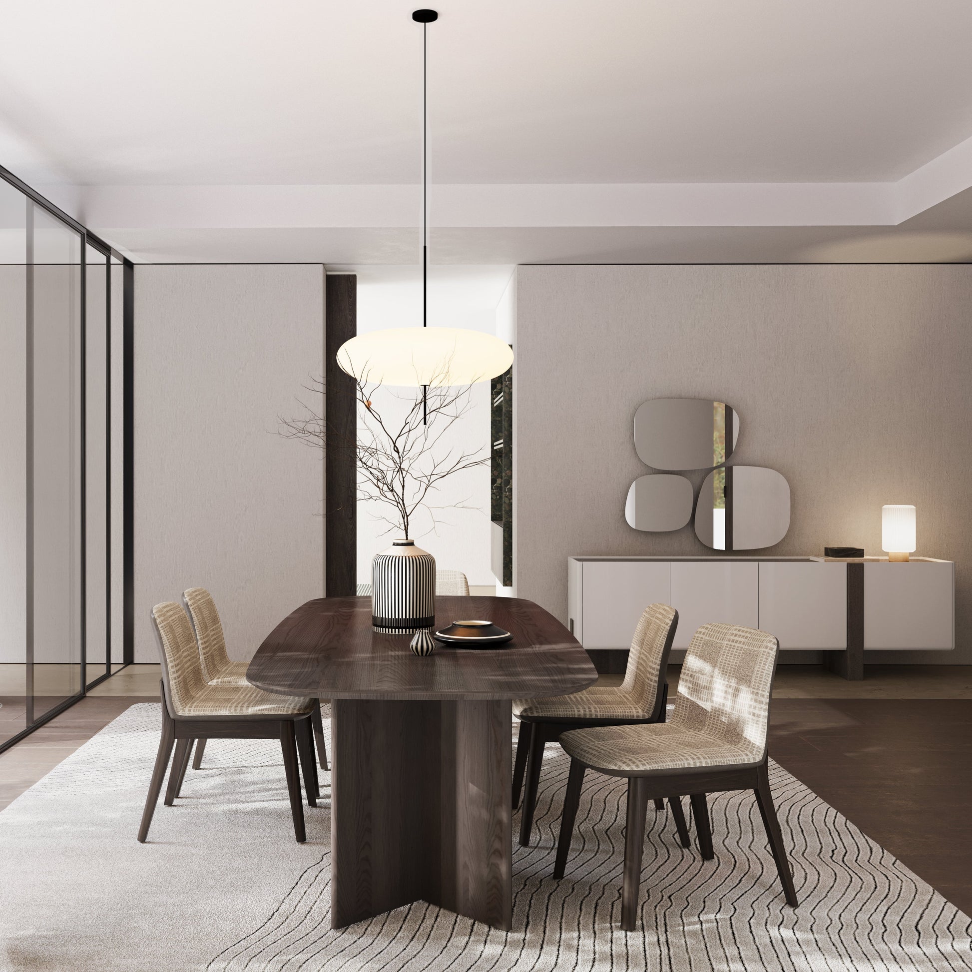 Modern dining room with wooden table and chairs, light fixture, and decorative elements.