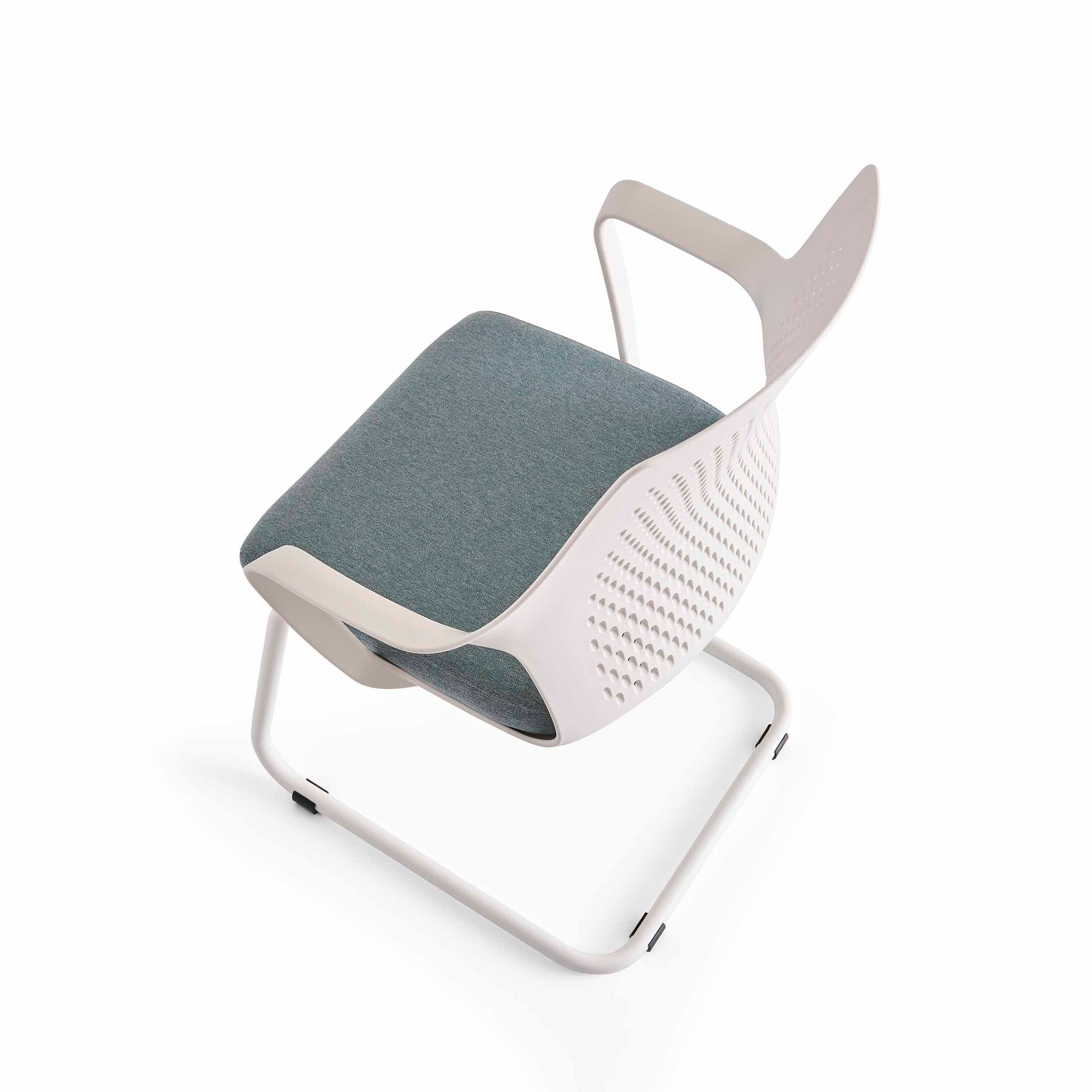 Modern chair with a gray cushion on a white background