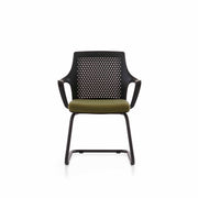 Modern chair with perforated backrest and green cushion on a white background