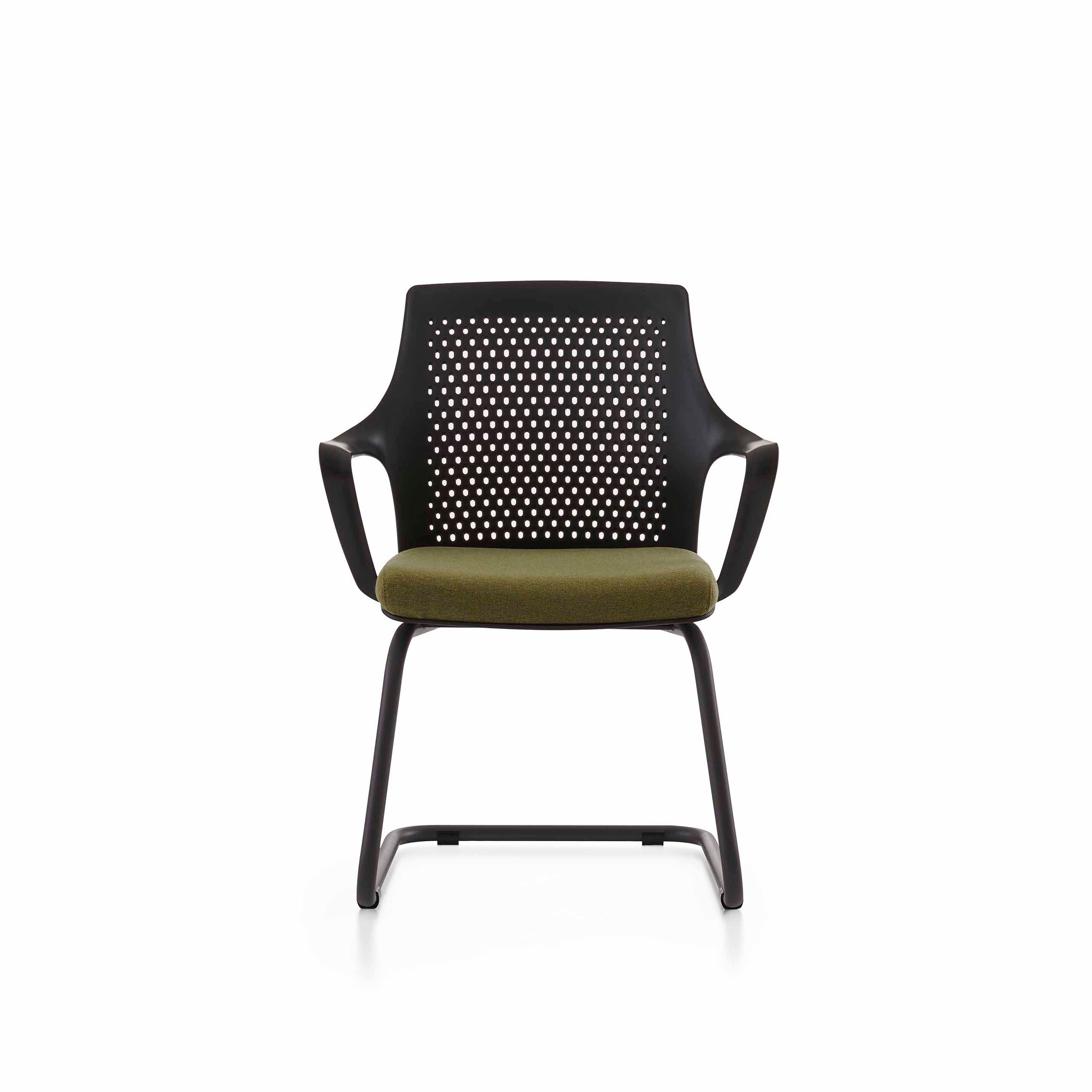 Modern chair with perforated backrest and green cushion on a white background
