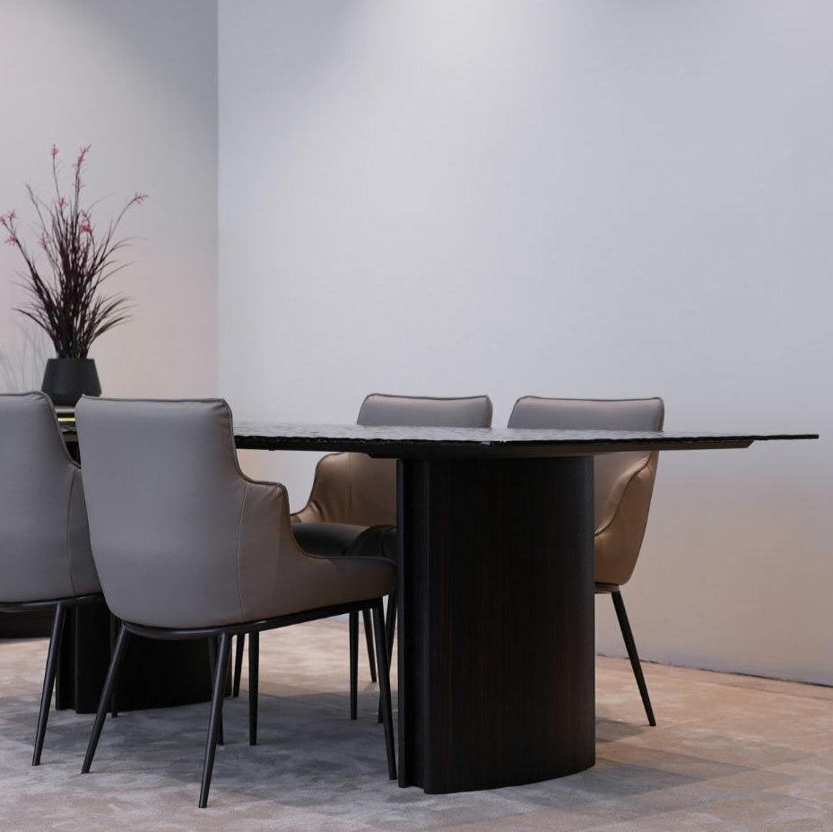 Flow Dining Table styled in a modern dining room with minimalist decor and elegant lighting.
