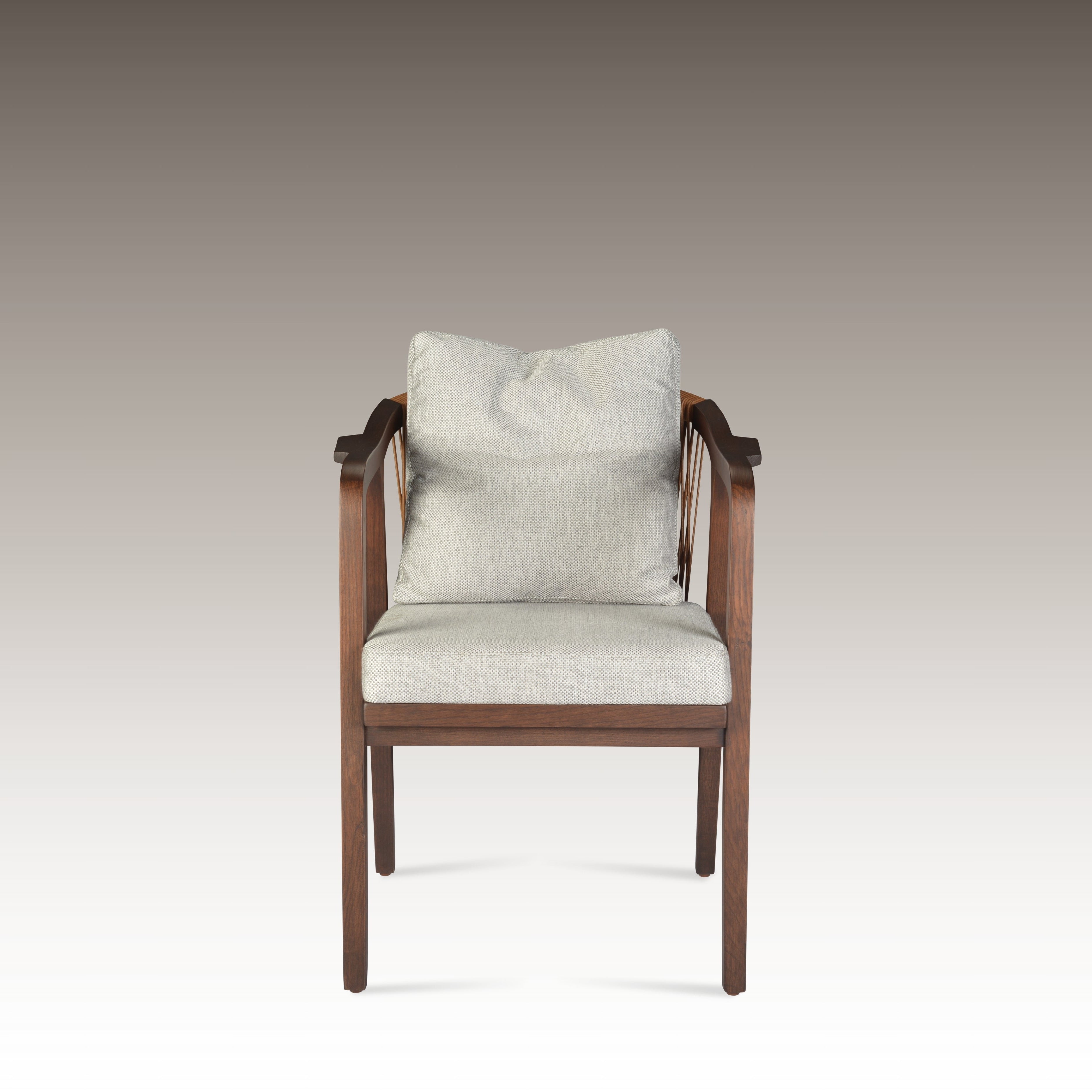 Breeze Dining Chair with wooden frame and soft gray cushions, perfect for dining spaces.