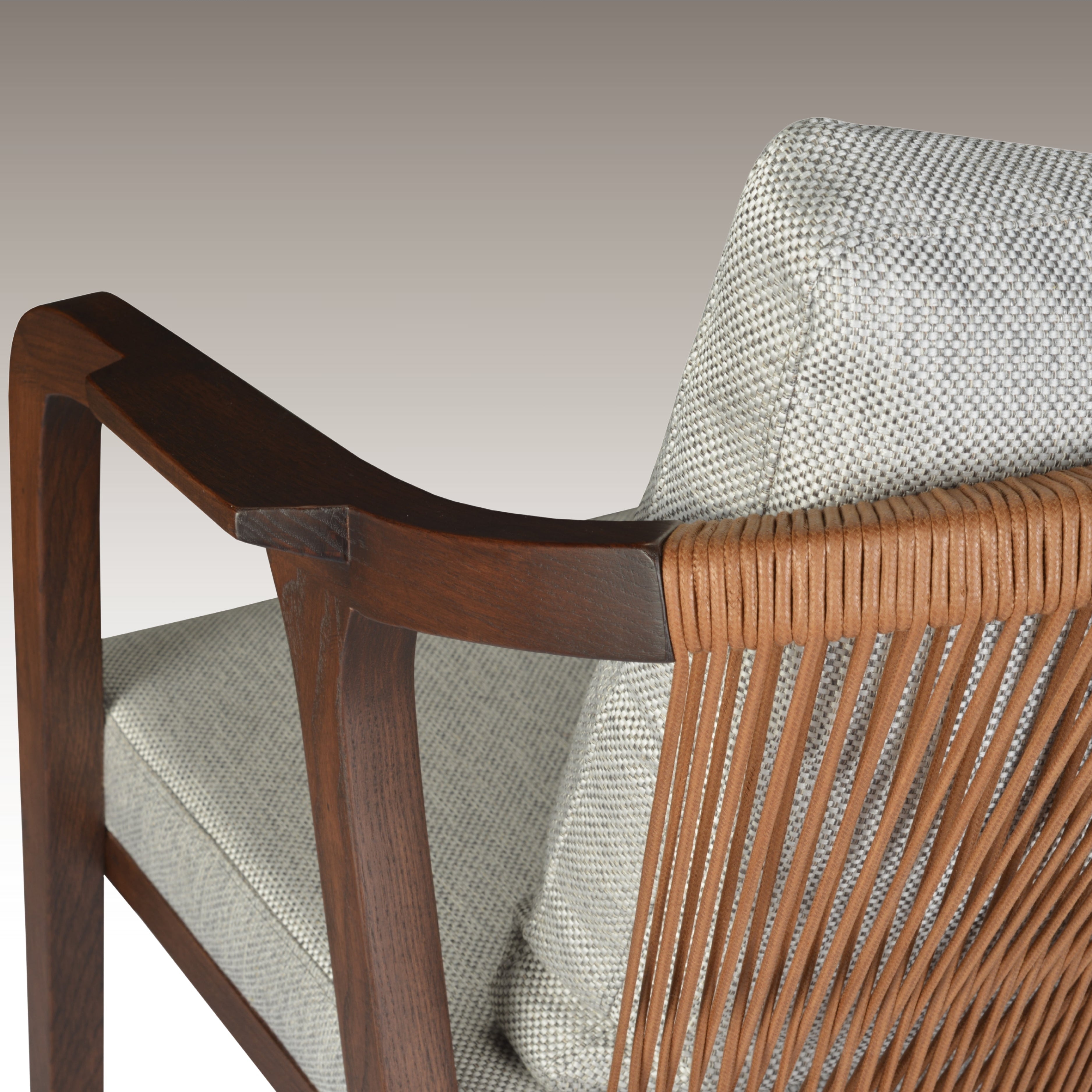 Breeze Dining Chair with wooden armrests and woven detail, showcasing its modern design and comfort.