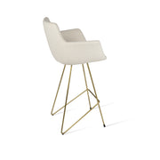 White bar stool with gold metal legs on a white background