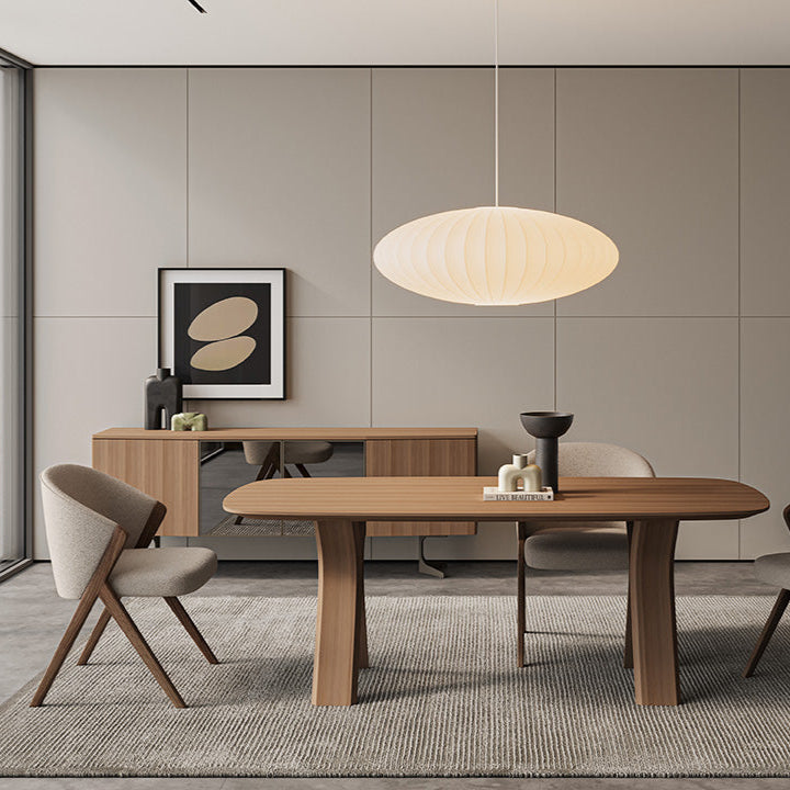 Koza Dining Table styled in a modern dining room setup, adding elegance and functionality.