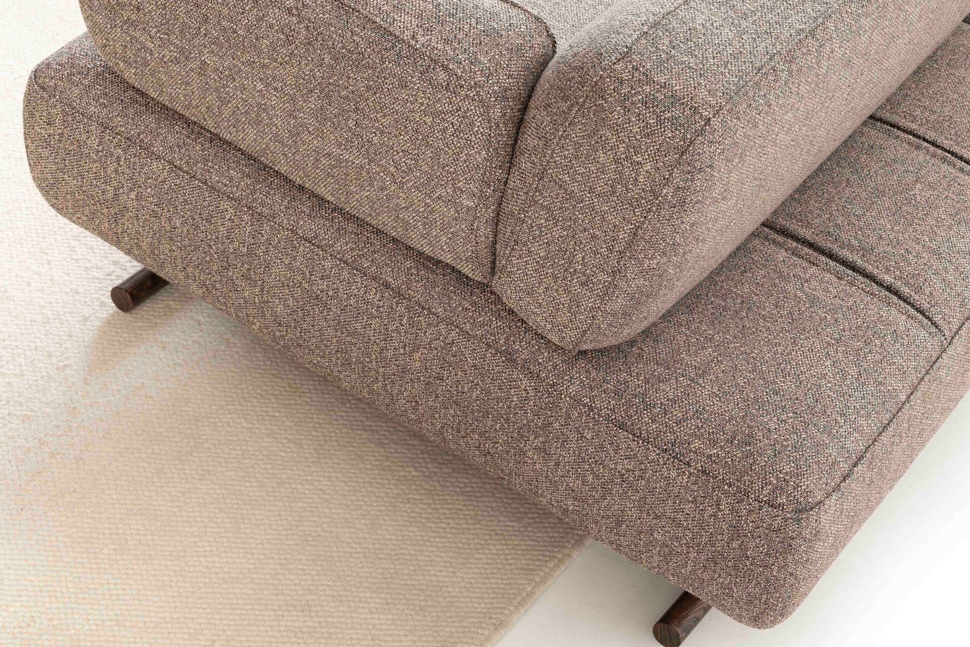 The backrest slides back and forth for adjustable comfort.