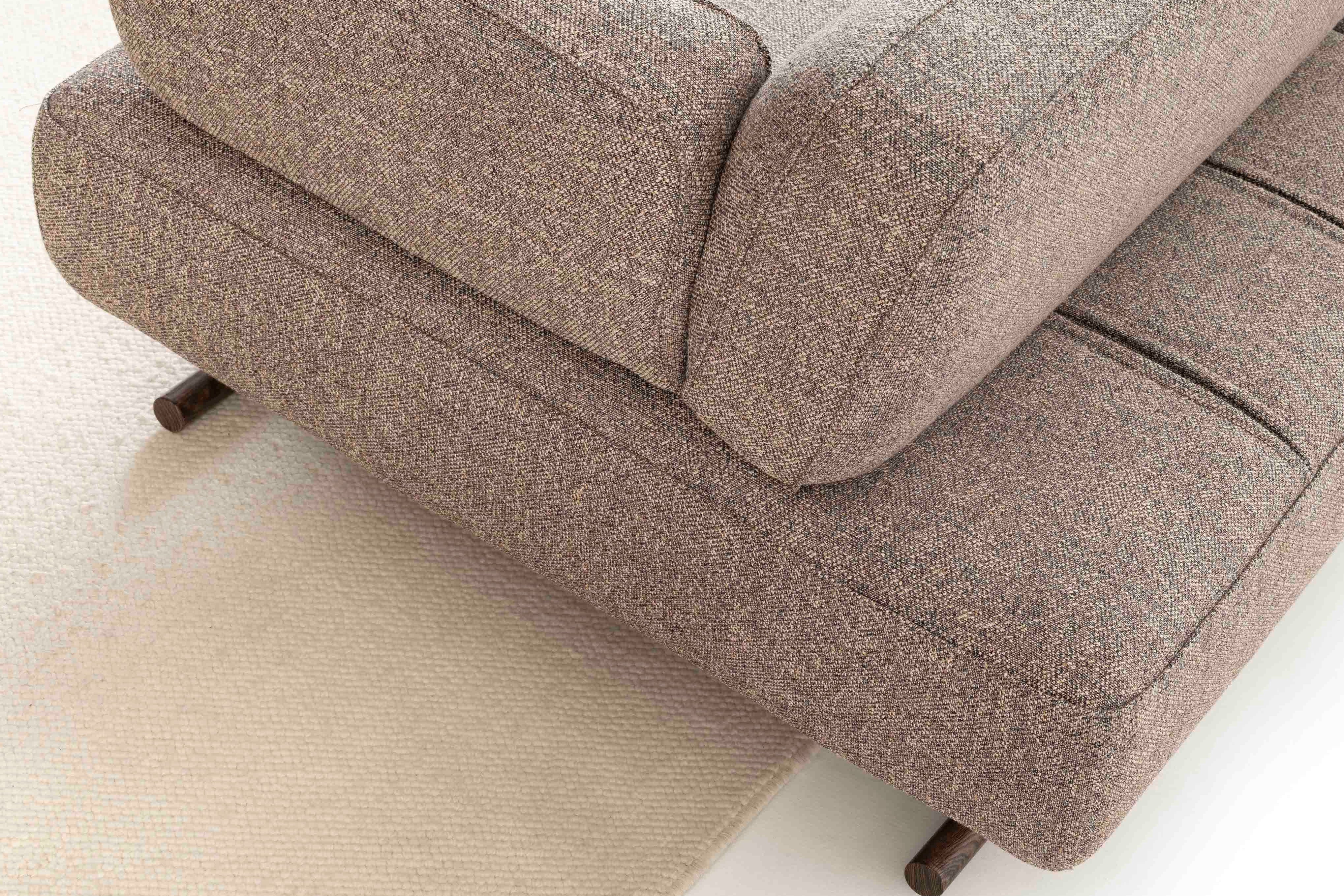 The backrest slides back and forth for adjustable comfort.