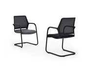 Two black office chairs with mesh backrests on a white background