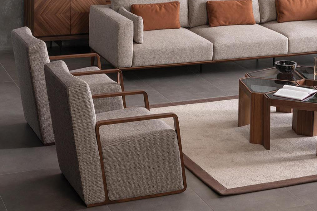 Mega Bergere Armchair styled with a decorative pillow for a cozy and stylish touch.