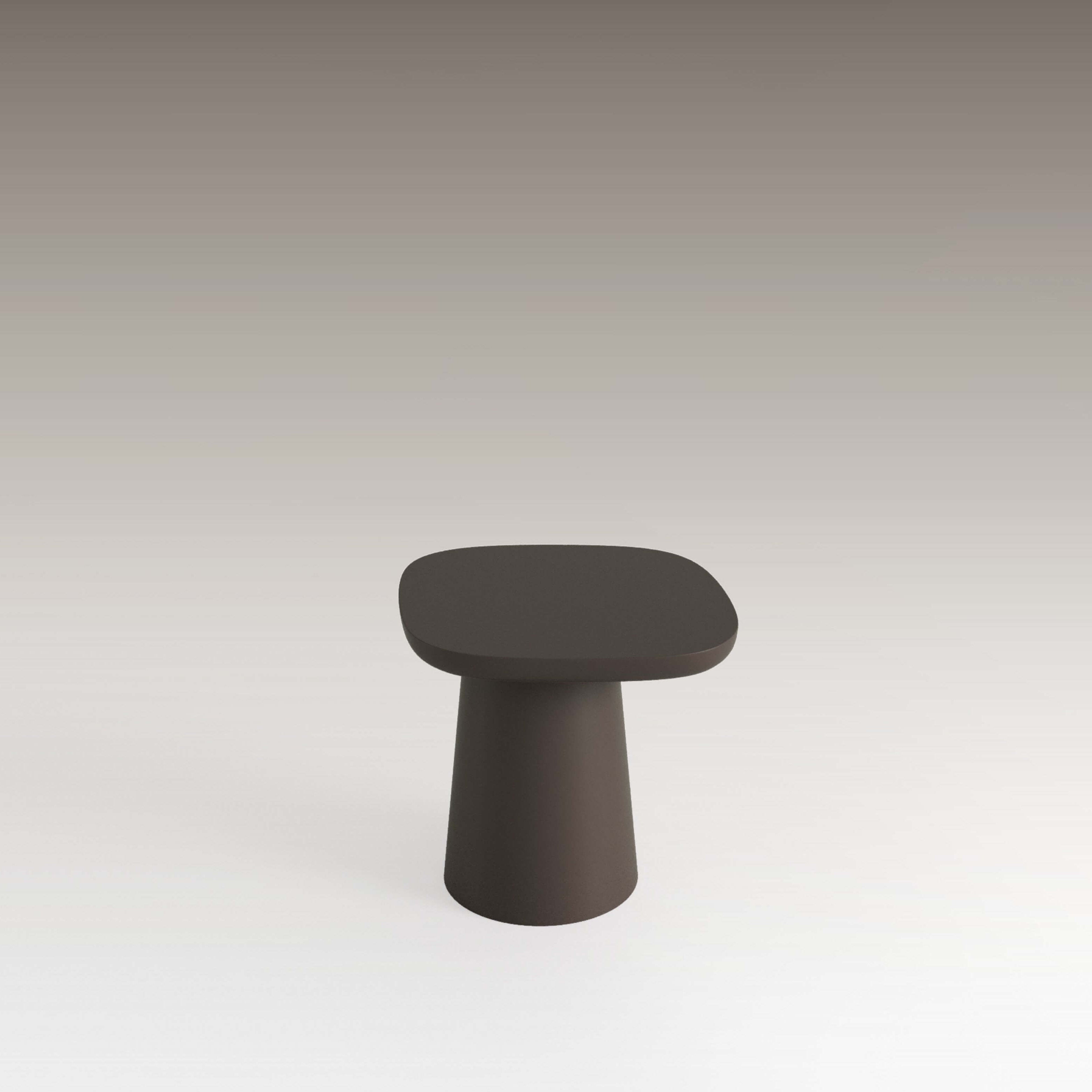 Stylish dark brown side table with a rounded top and solid tapered base, enhancing modern decor.