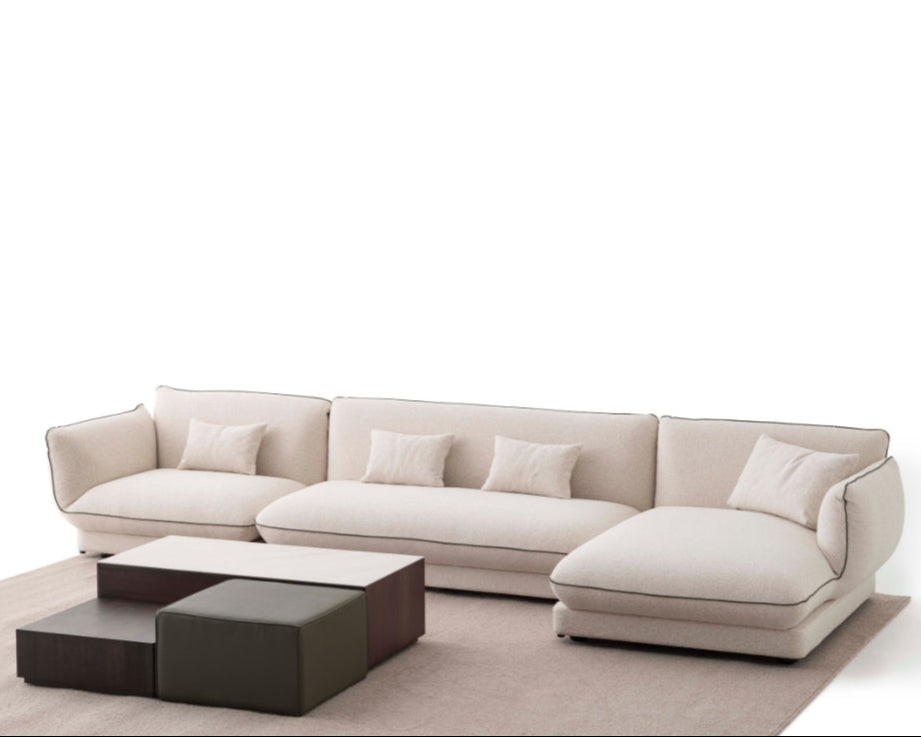 Orbit Plus Modular Sofa in a contemporary living room, featuring minimalist decor, abstract wall art, and a modern floor lamp.