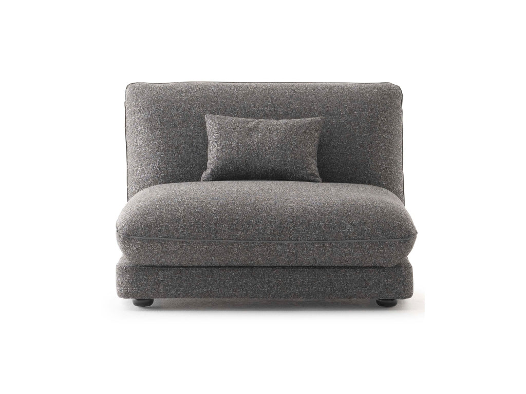 Orbit Plus Modular Sofa decorated with textured pillows, enhancing its cozy and inviting feel.