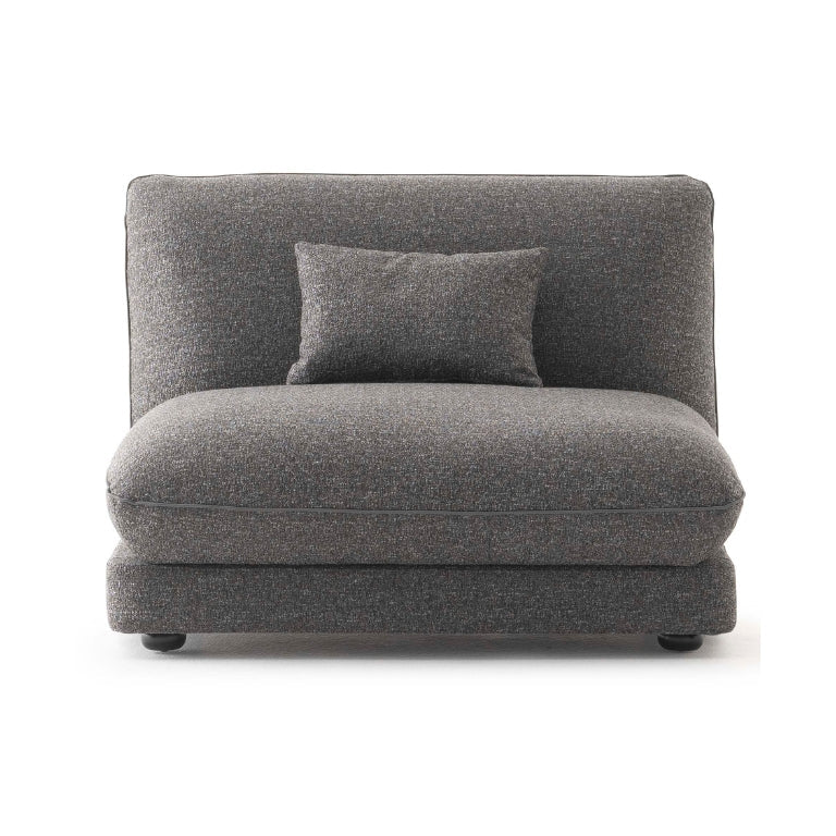 Orbit Plus Modular Sofa decorated with textured pillows, enhancing its cozy and inviting feel.