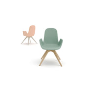 Two chairs, one pink and one green with wooden legs, on a white background