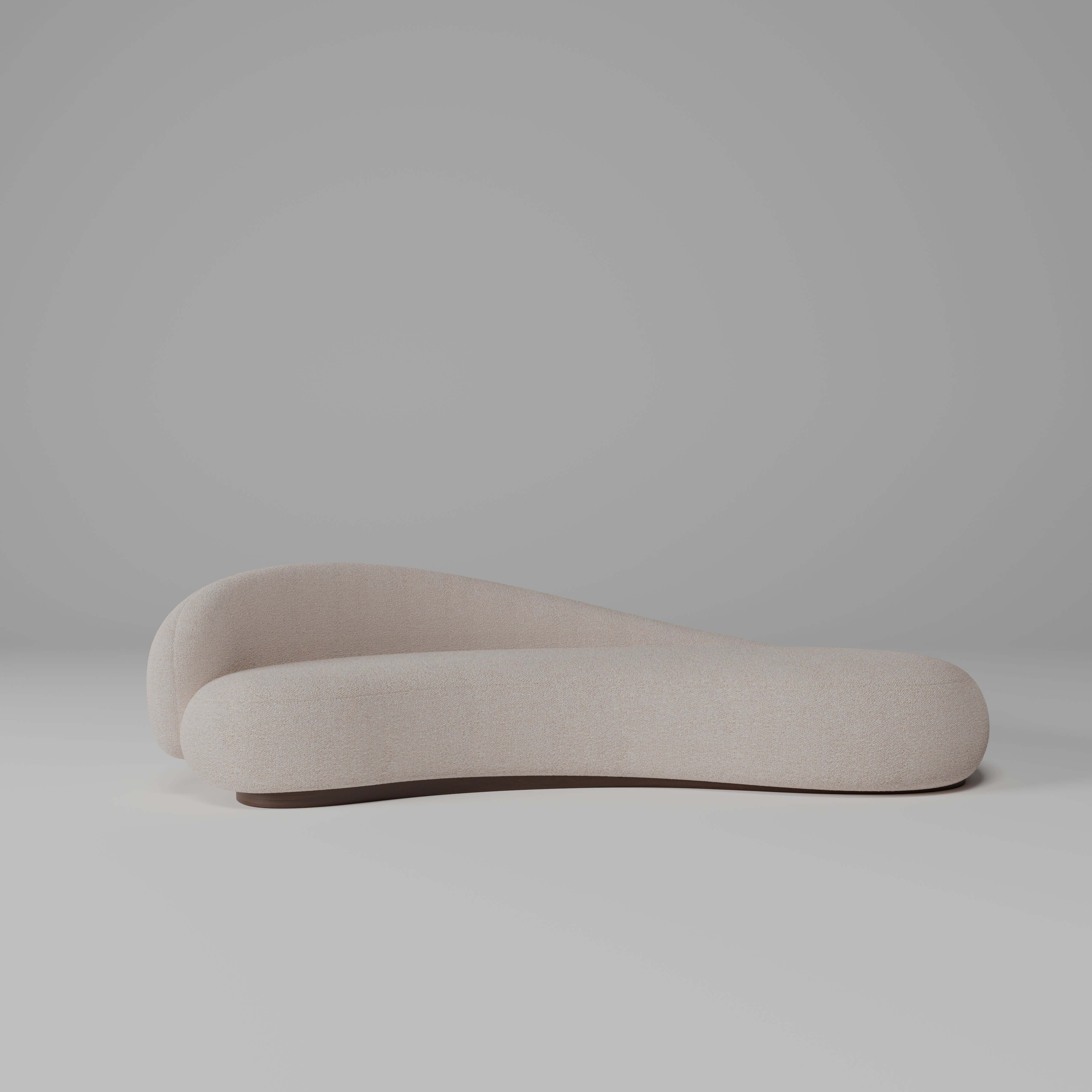 Papilio Curved Sofa in elegant beige, showcasing a modern sculptural design with gentle curves.