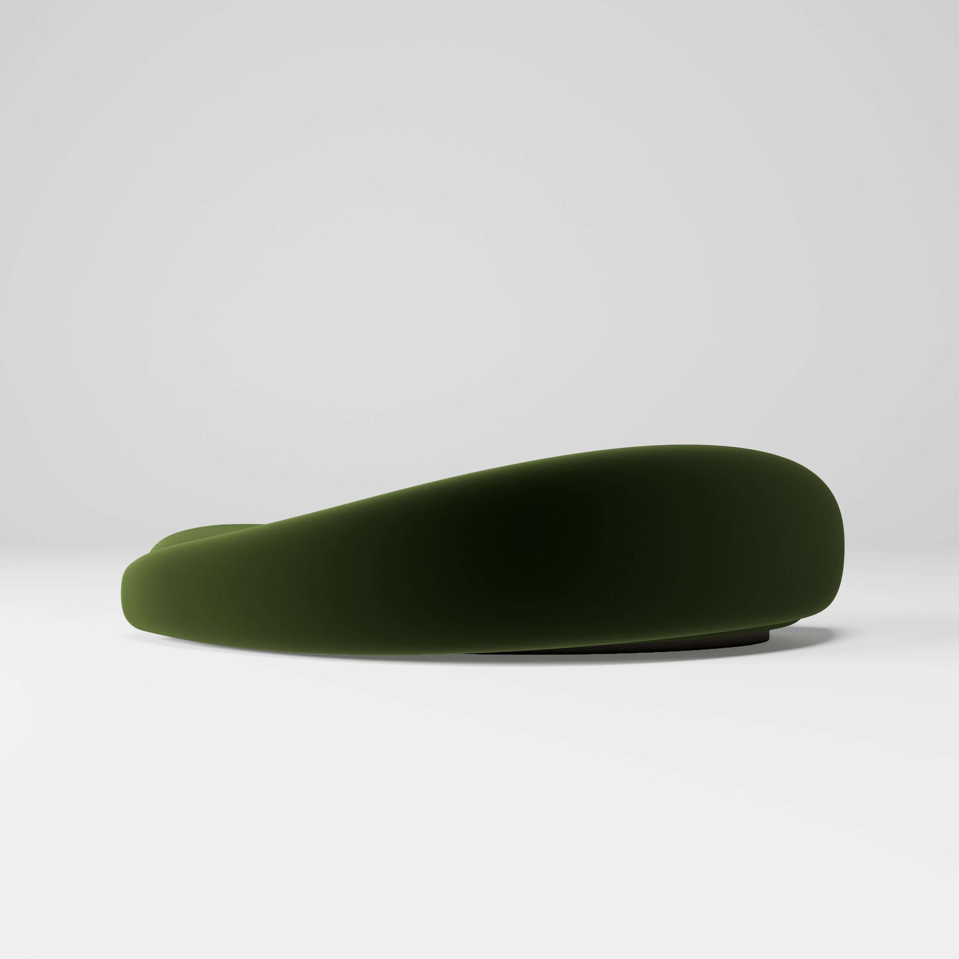 Papilio Curved Sofa in elegant forest green, showcasing a modern sculptural design with gentle curves.