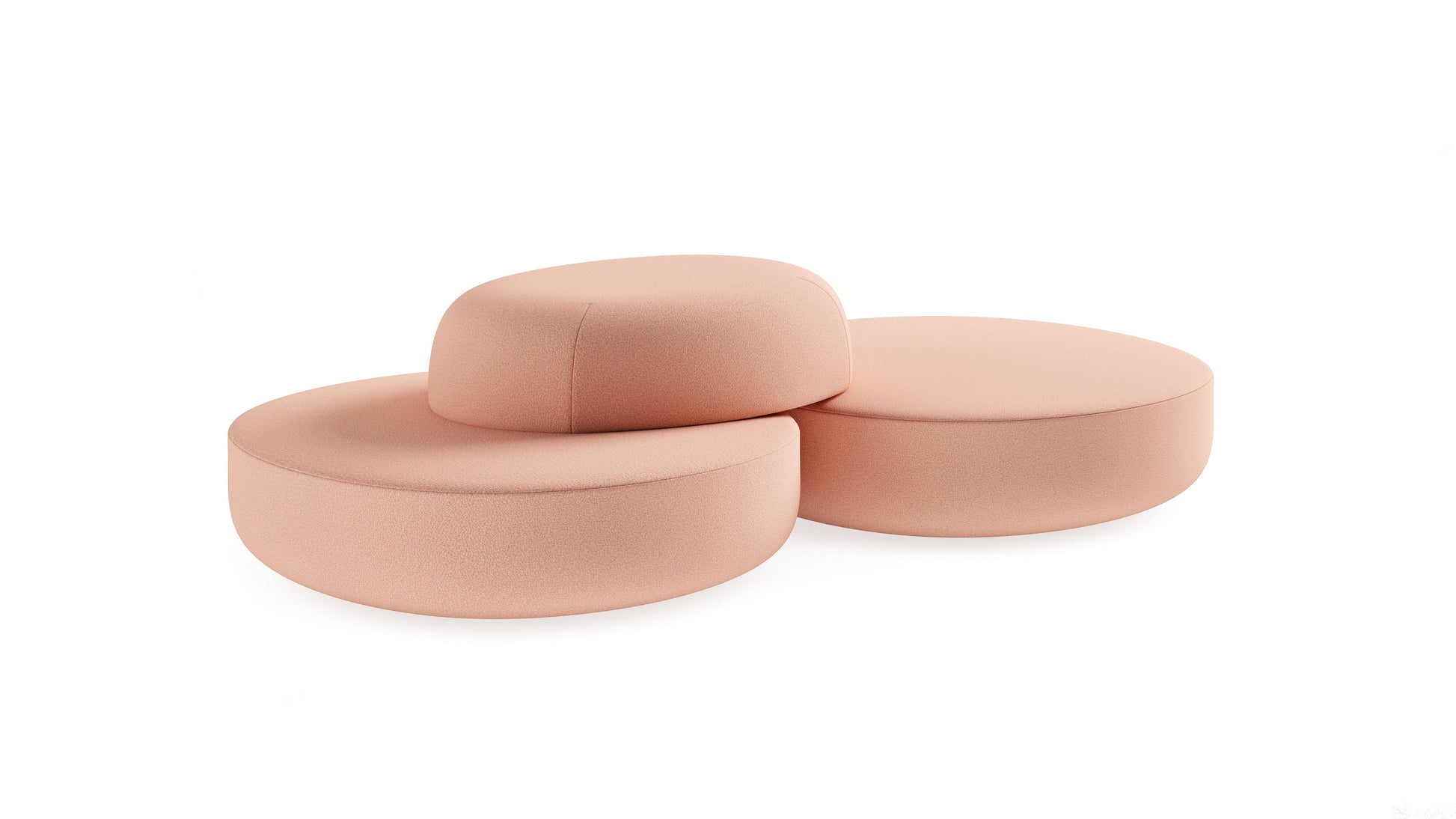 Three peach-colored cushions stacked on a white background