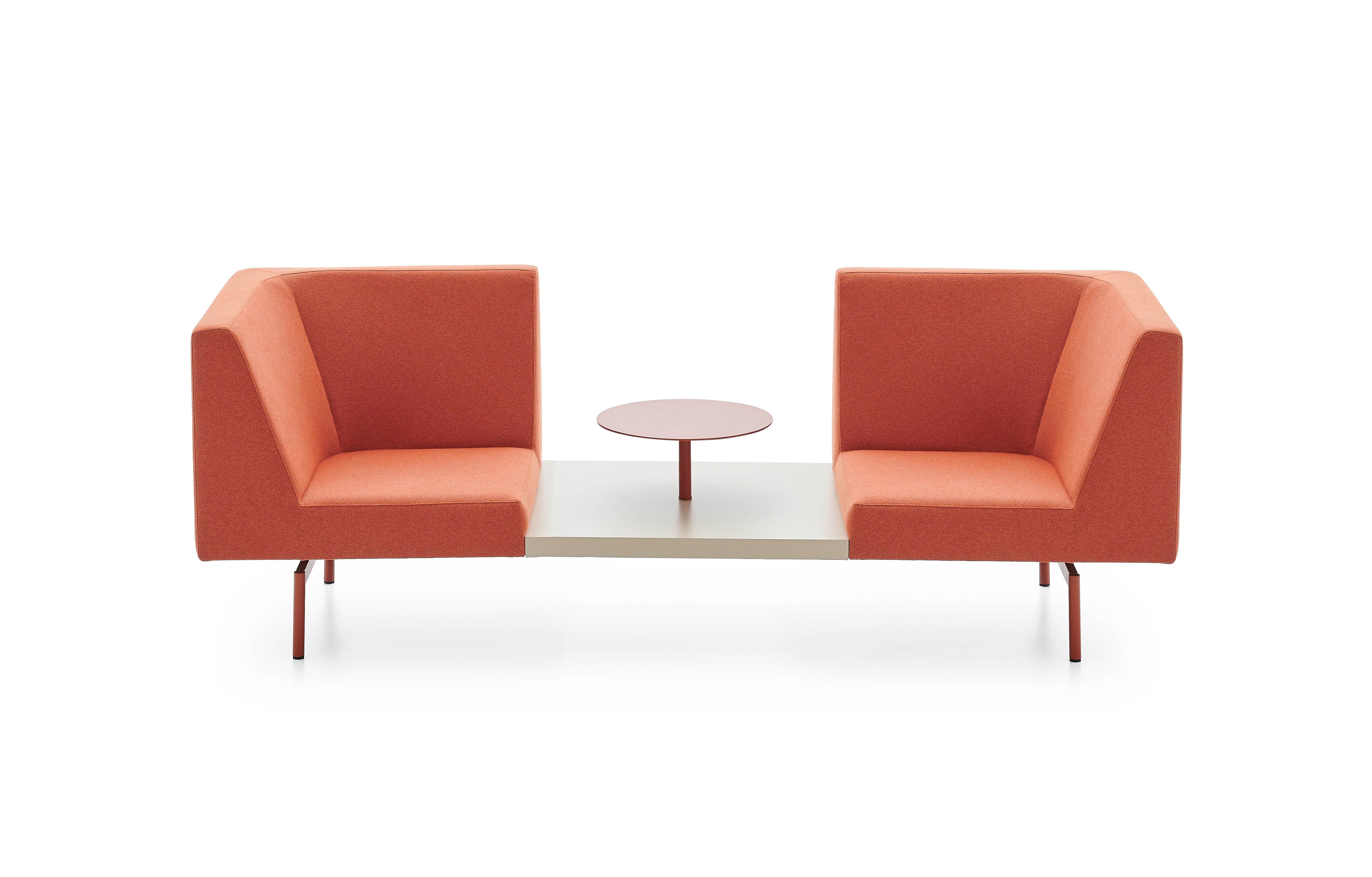 Two orange armchairs with a small round table on a white background