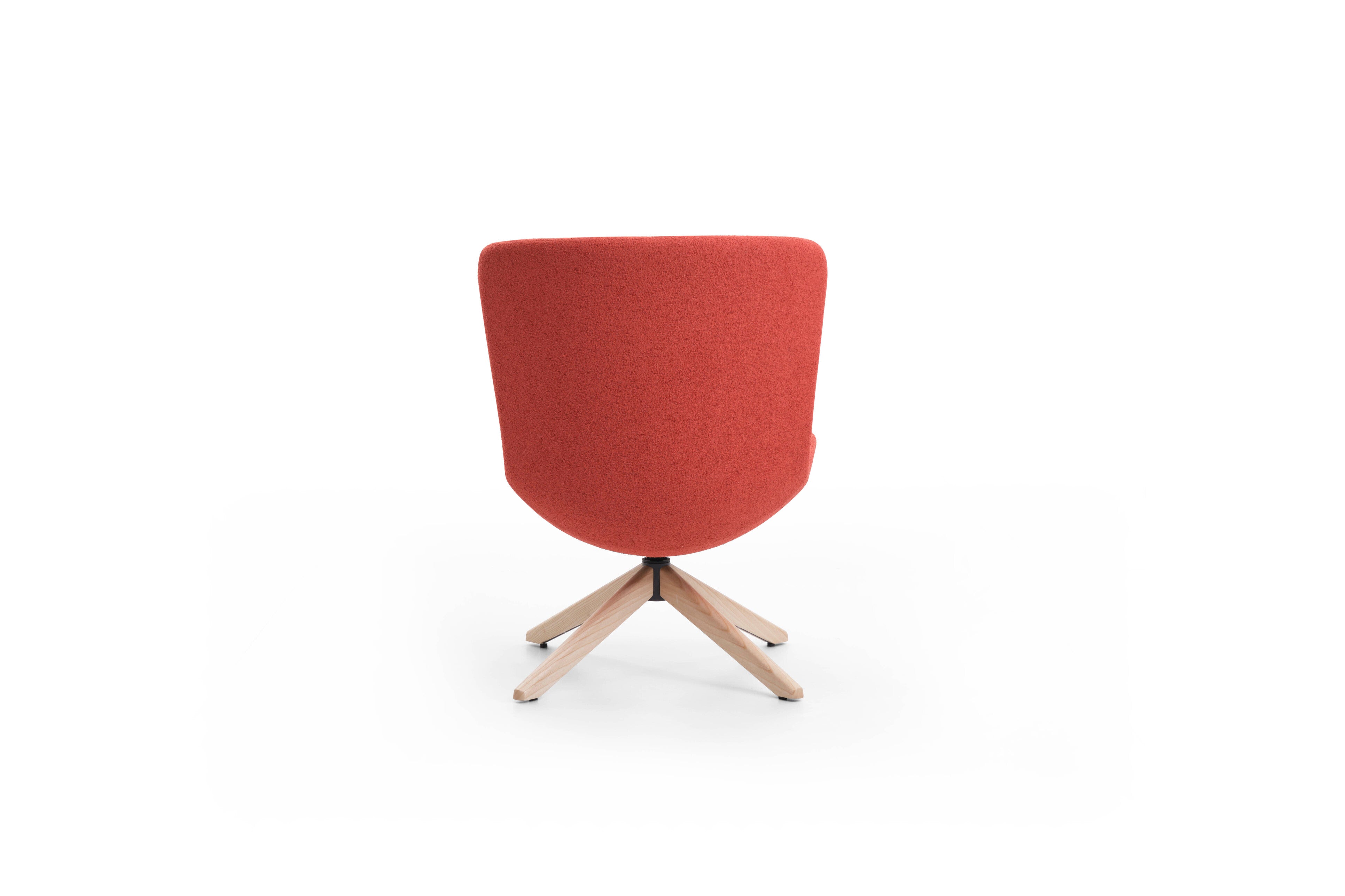 Red chair with wooden legs on a white background