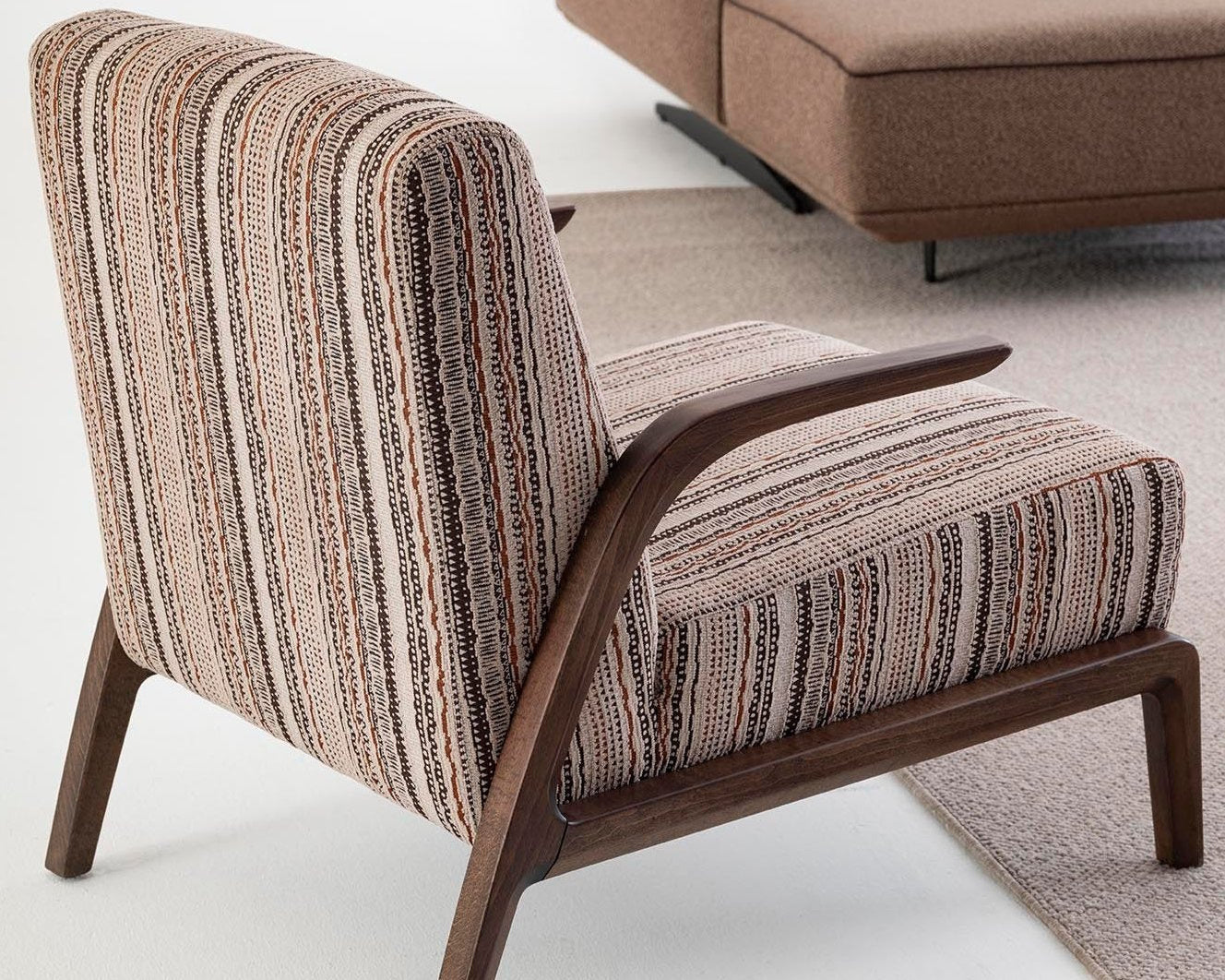 Savanna Armchair styled with a decorative throw pillow, creating a cozy and chic vibe.