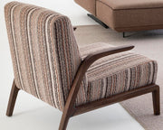 Savanna Armchair styled with a decorative throw pillow, creating a cozy and chic vibe.