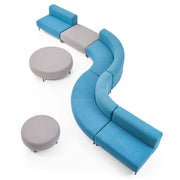 Blue curved sofa with gray ottomans on a white background