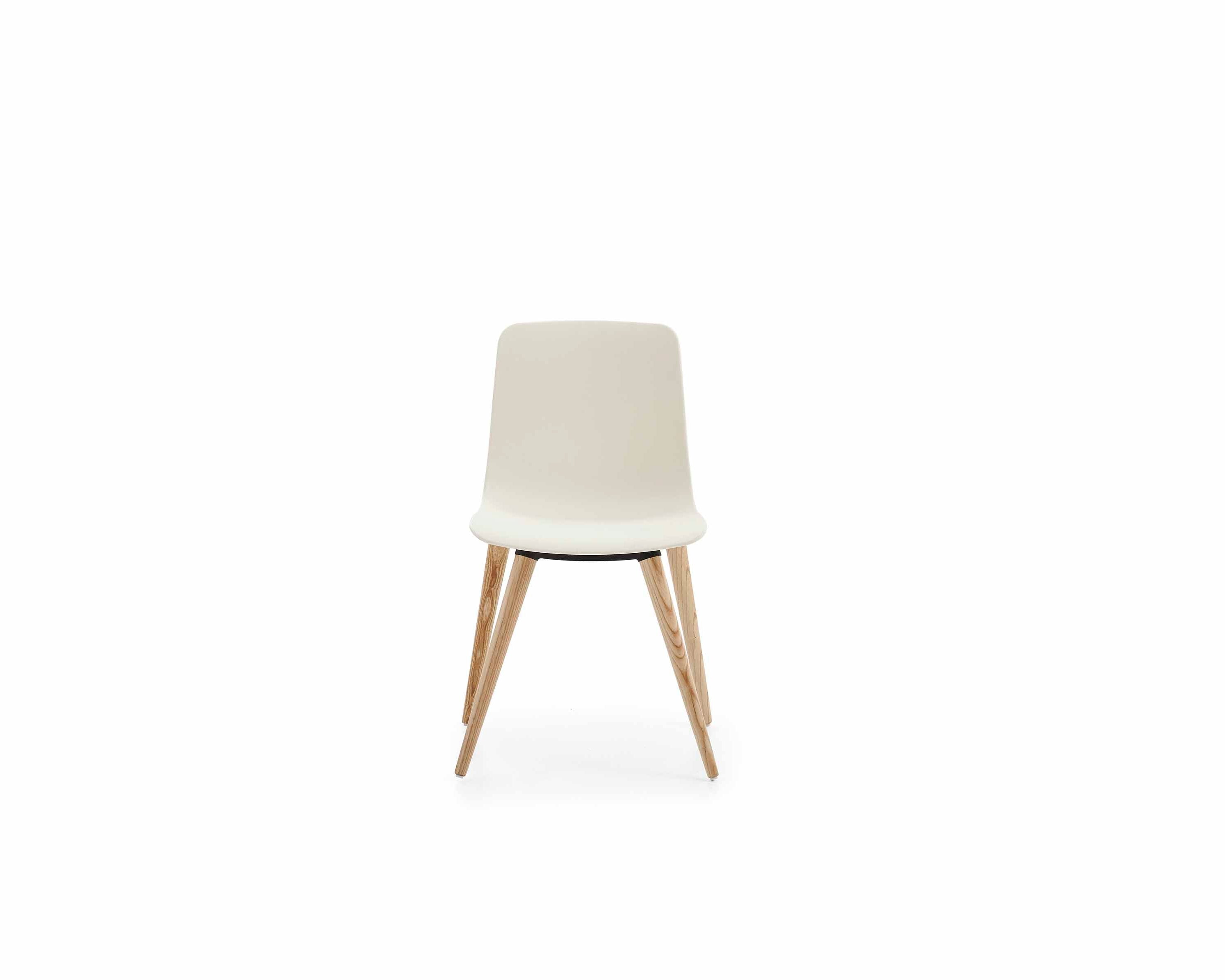 White chair with wooden legs on a white background