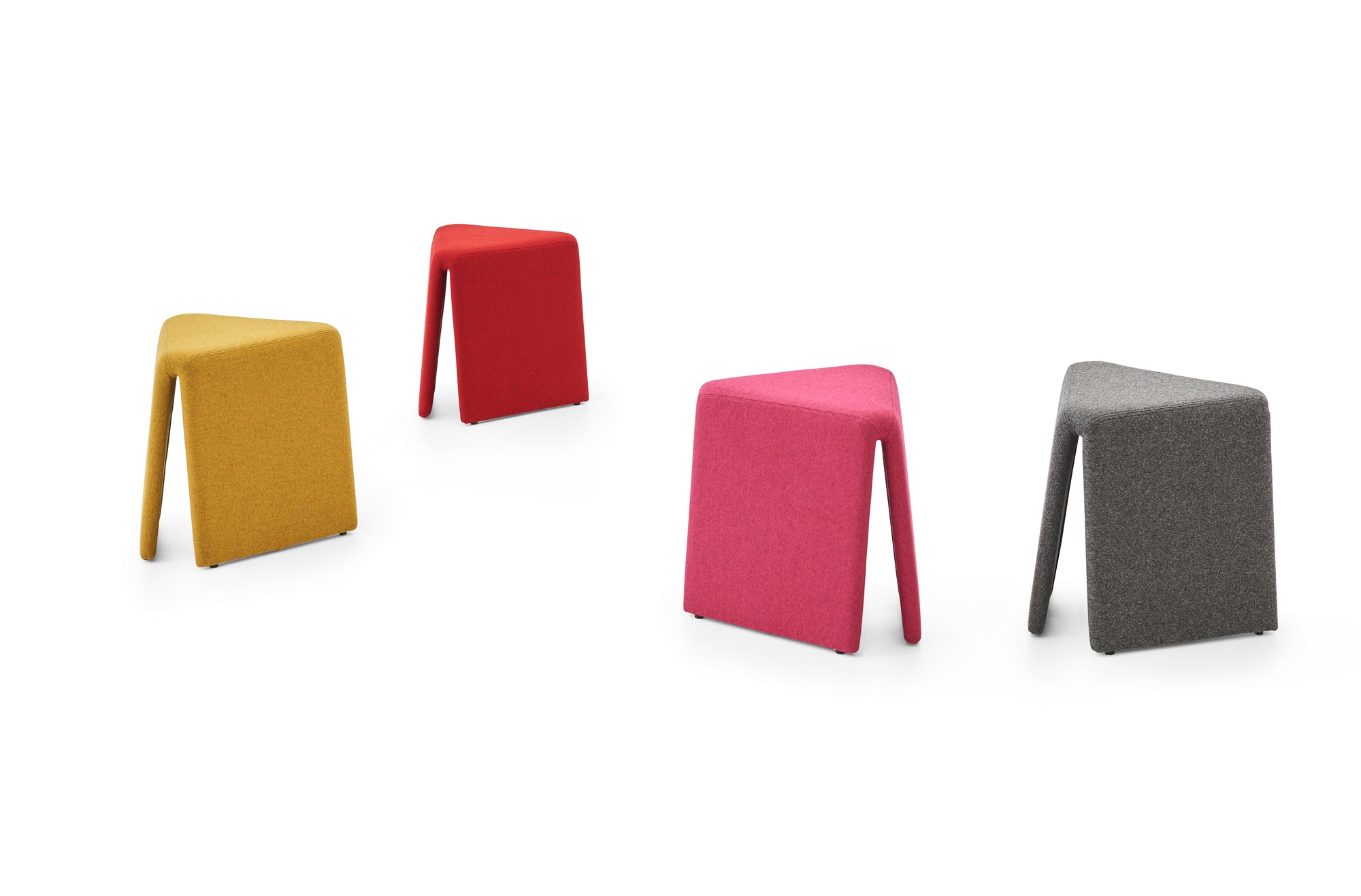 Four colorful stools in different shapes and colors on a white background