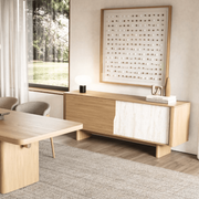 Tierra Oak Sideboard in warm oak with stone-textured panel and tapered legs.Minimalist design with natural materials and concealed storage.