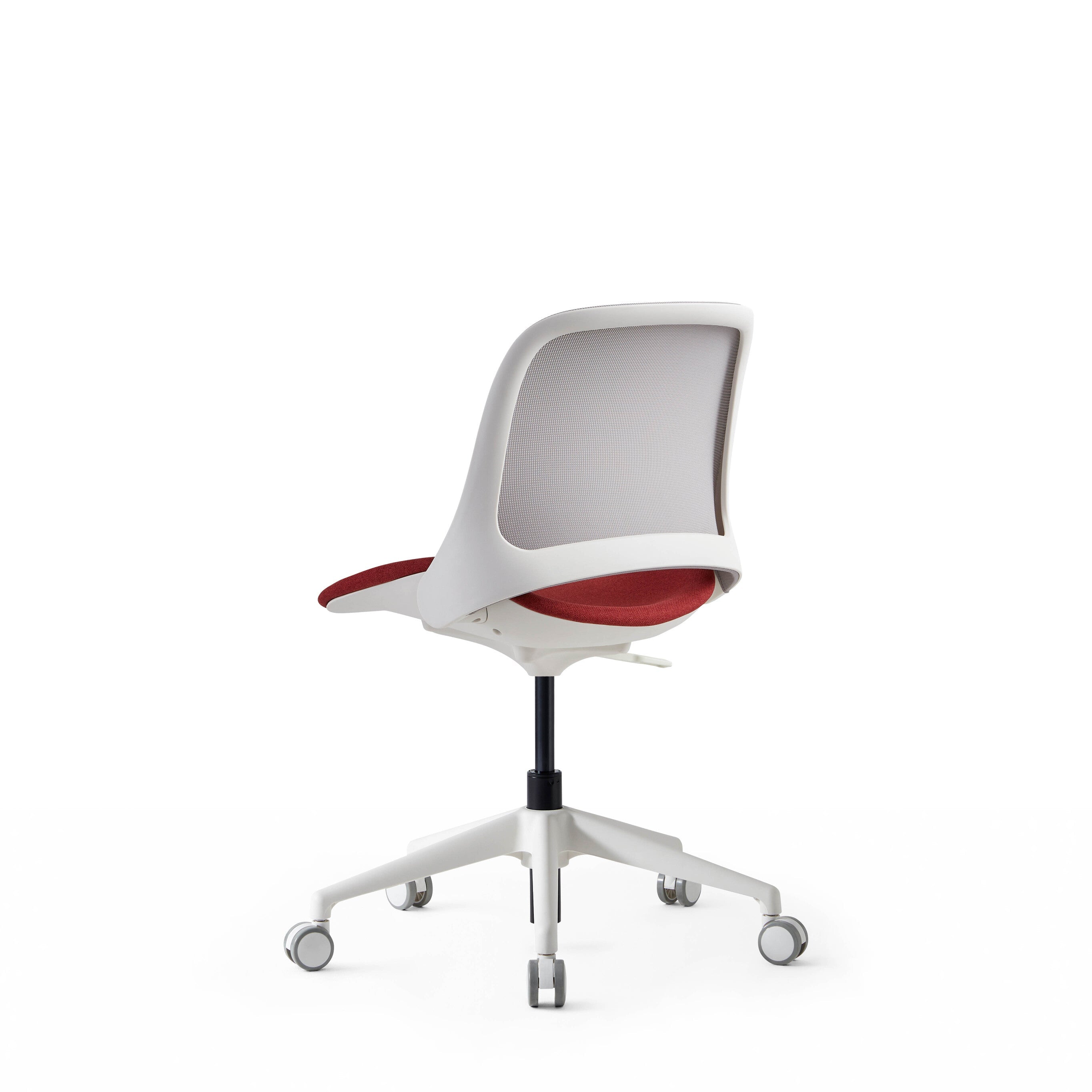 Modern office chair with red seat and white frame on a white background
