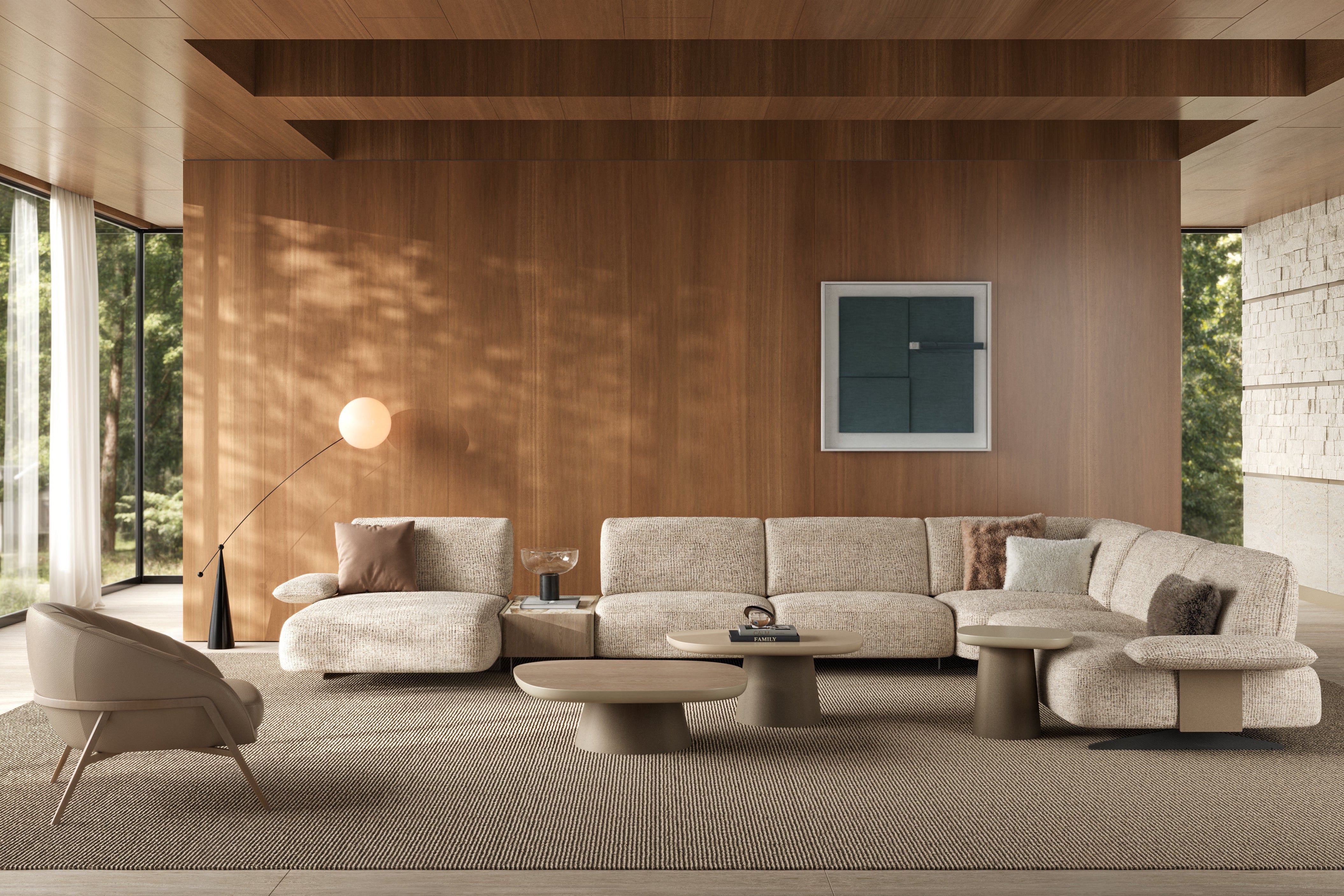 Modern living room with beige sofa, armchair, and coffee table in a well-lit room with wooden walls.