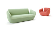 Green sofa and red chair on a white background