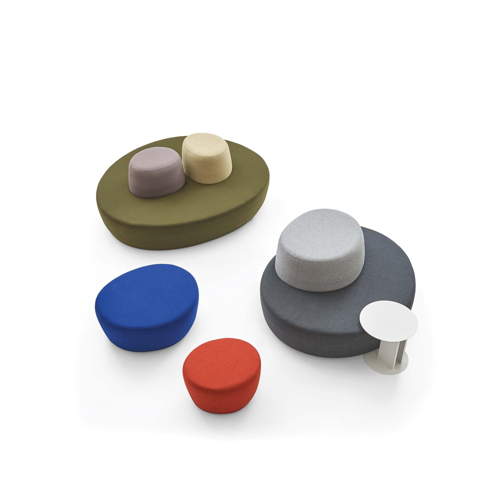 Set of colorful round ottomans on a white background