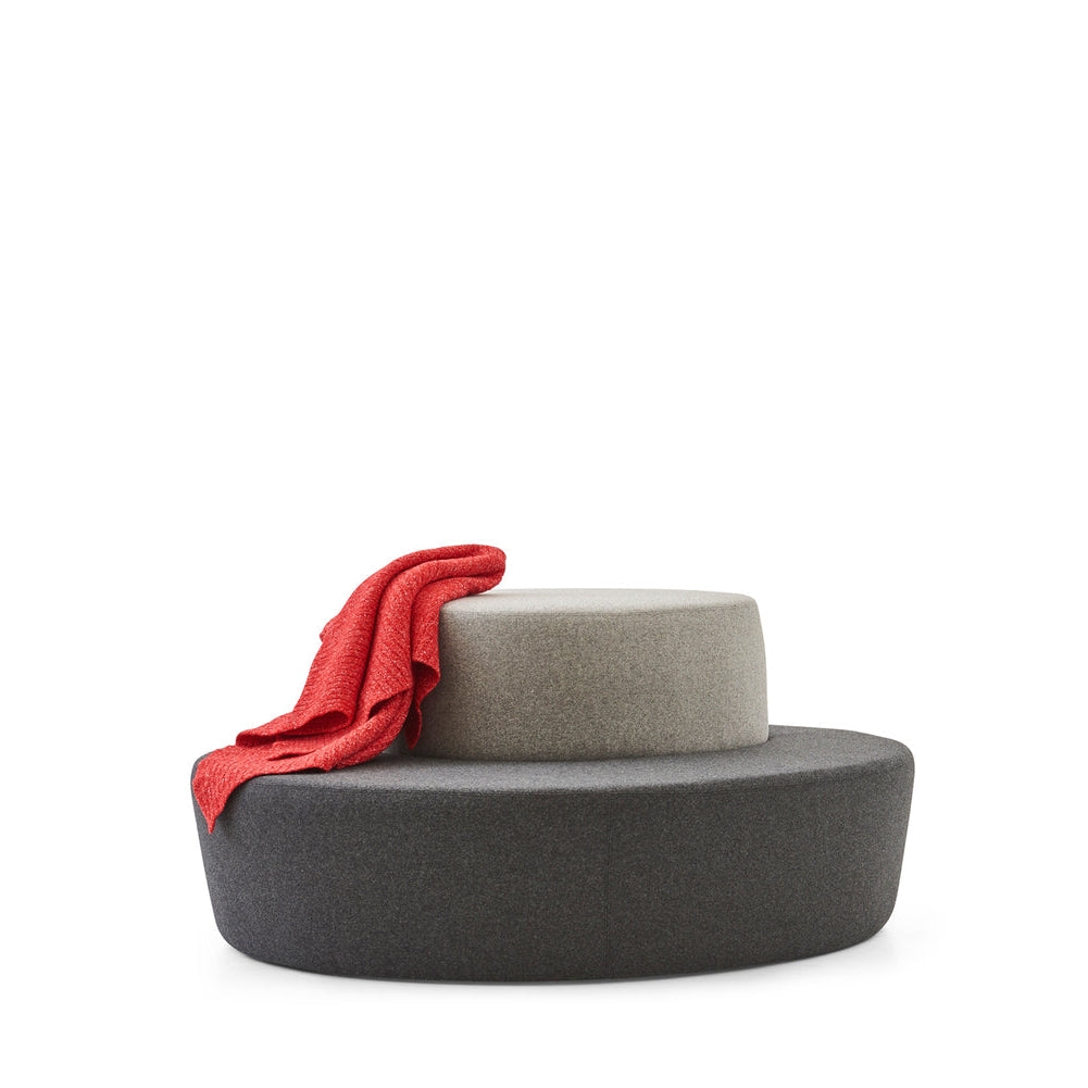 Modern chair with a red cloth draped over it on a white background