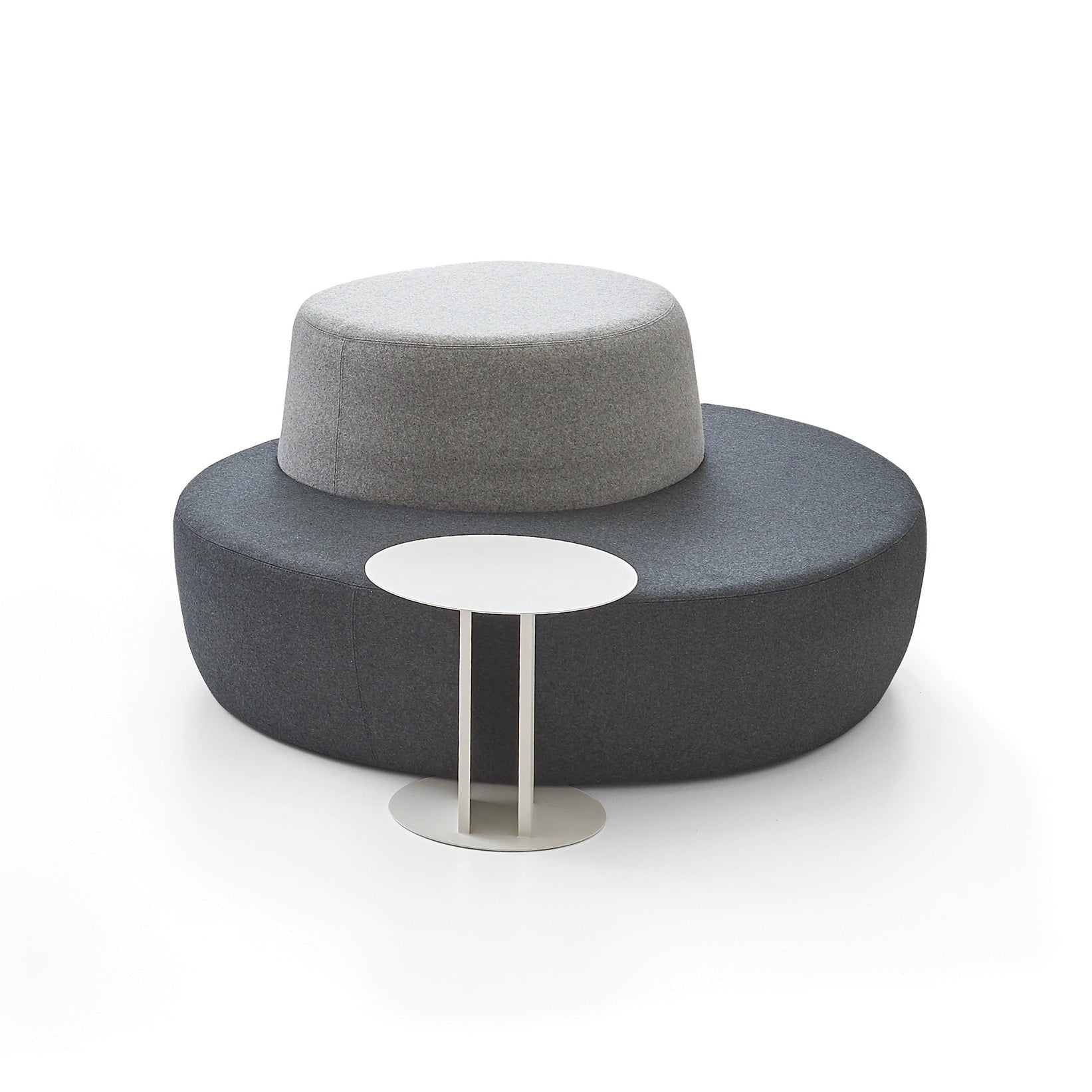 Modern gray and white round ottoman with a small round table on a white background